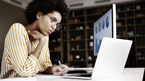 A person preparing graphs and charts in a presentation