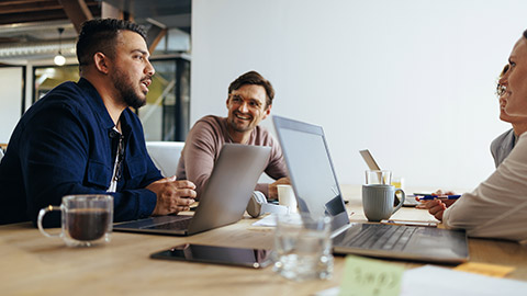 Marketing professionals having a discussion in a meeting.