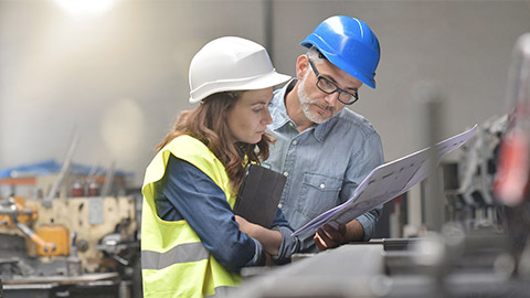 Metal industry manager and engineer meeting in factory