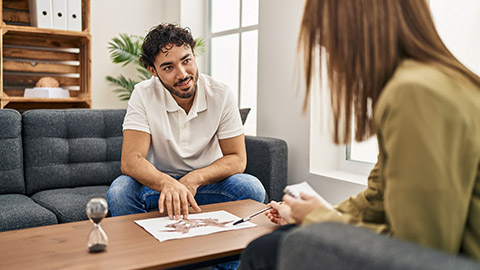 Man and woman having some conversation in a session at psychology center