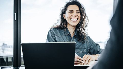 Happy woman doing an interview