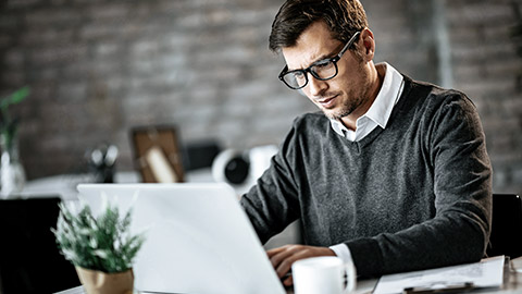 Man reading on computer