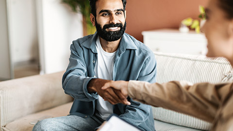 Shaking hands of client and psychotherapist