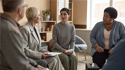 mature woman talking to female psychologist and sharing mental health problems