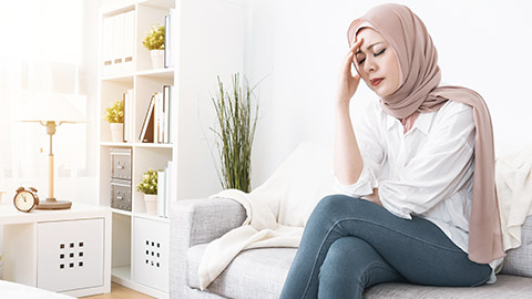 woman feeling headache