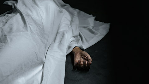 dead body under white cloth