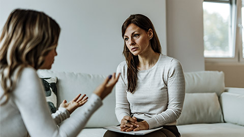 serious woman talking to her client