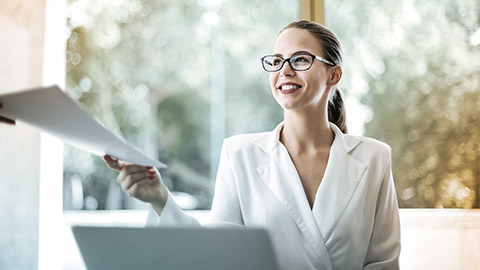 woman receiving paper