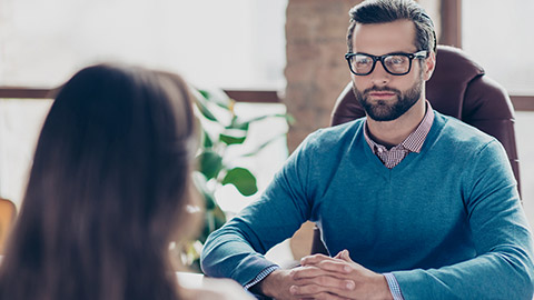 man talking with a woman in an office