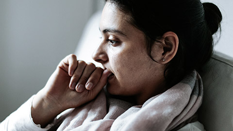 Woman biting nails