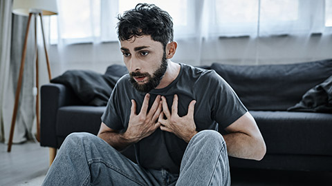 Traumatized man having panic attack