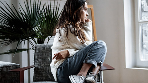 Lonely girl sitting on chair