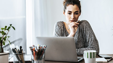 Woman intensely looking at the computer