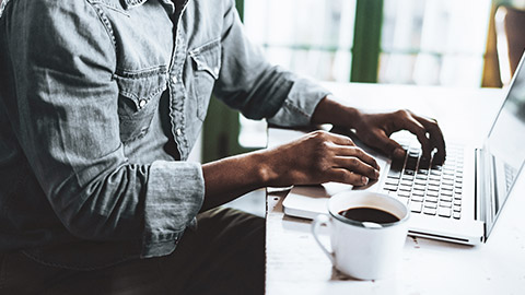 Man's hand on laptop