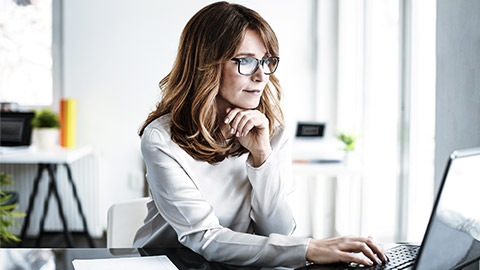 Mature woman working on computer