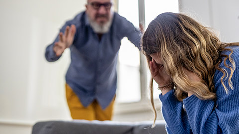 woman being scolded by a man