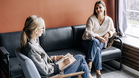 happy woman talking to a coach