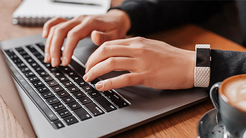 A close view of a person typing on a keyboard