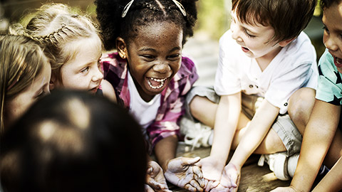 A group of children happily interacting with each other