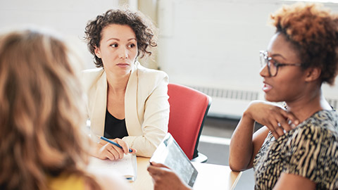 A group of people in a serious discussion