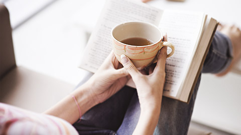 A person reading a self-help book