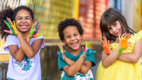 Diverse kids participating in a painting exercise