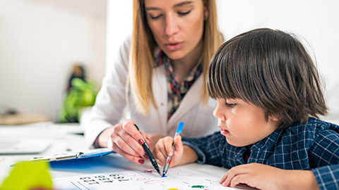 A teacher assessing a student's progress on an activity