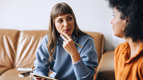 2 coworkers discussing work stuff