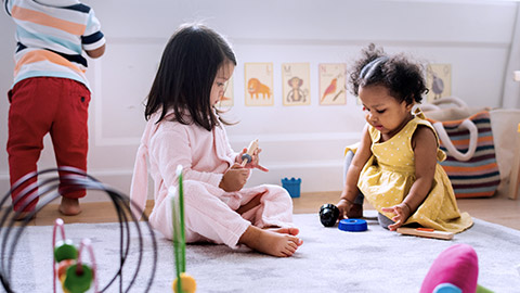 Little kids playing toys