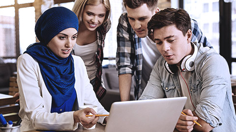 Diverse people looking at the computer