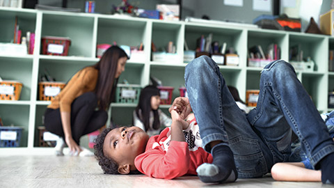 Stubborn child lying on the floor