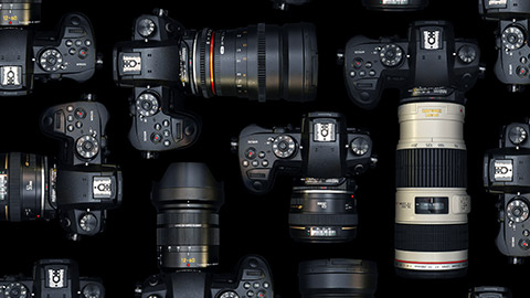 A top down view of multiple cameras and lenses