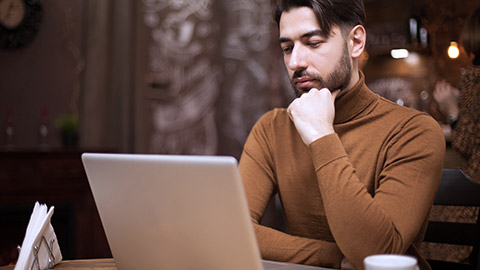 Man thinking while looking at the computer