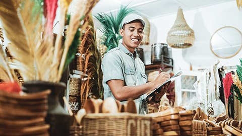 A small business owner looking at supplies