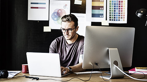 A graphic designer working inside a studio