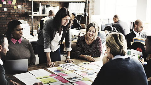 A group of people in a department strategizing communication requirements for work activities