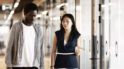 Two people talking in the workplace