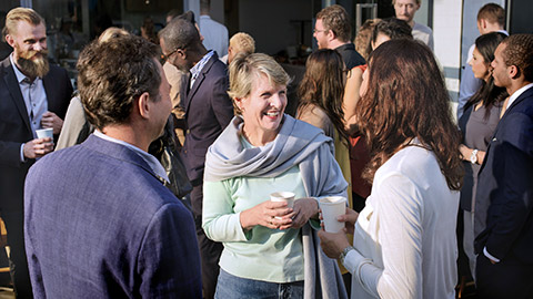 Diverse people mingling at event