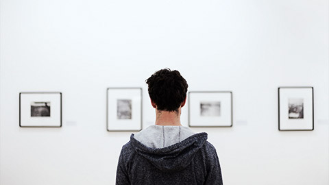 A person looking at drawings