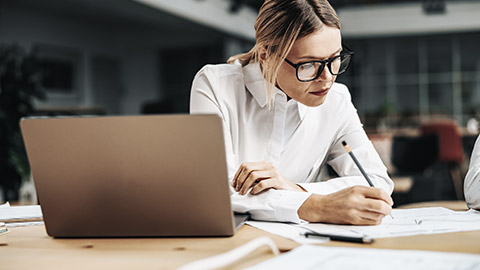 Woman focusing on notes