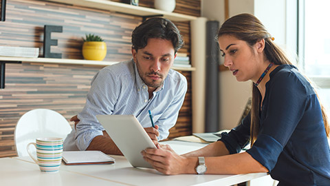 Two designers discussing a brief