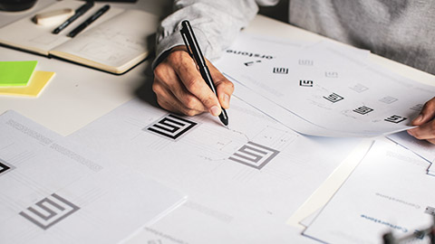 A designer drawing a logo