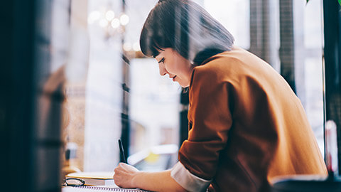 A manager writing out a work plan