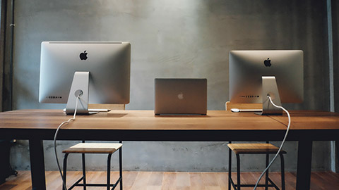 A group of computers in an office