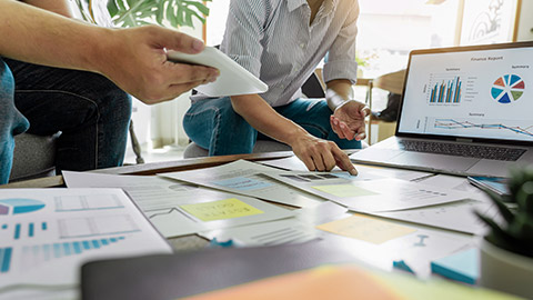 people writing on sticky notes for colleagues thinking strategy business plan or over problem