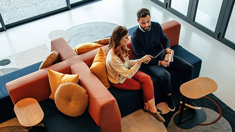 2 colleagues in a relaxed office environment