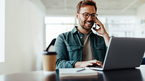 A person talking to a stakeholder on a phone