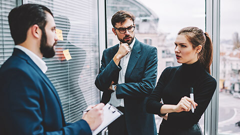 A group of colleagues having a tense discussion