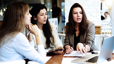 women on serious meeting