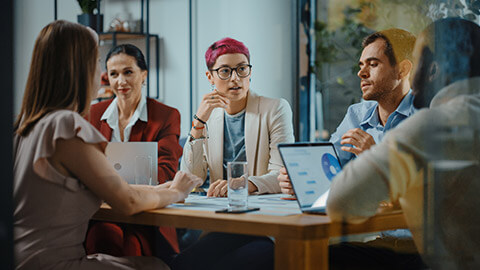 A group of colleagues in a meeting room